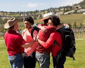 Identical twins Treena and Tennille say goodbye to the cowboys following their elimination.